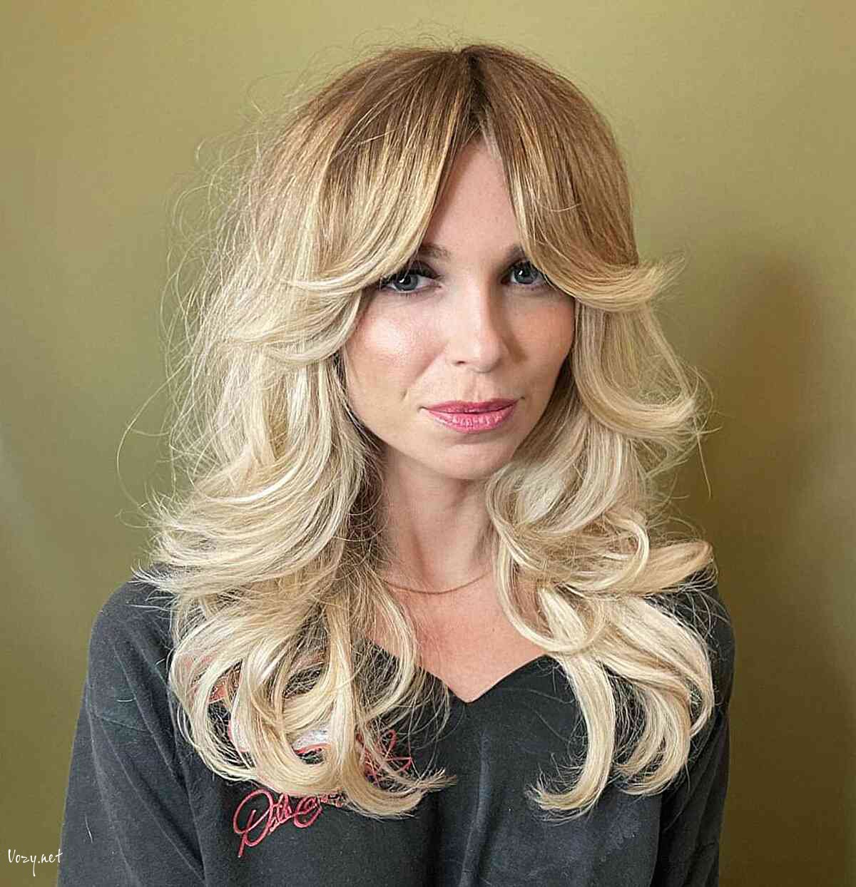 trendy blonde shag with curtain fringe and curled ends