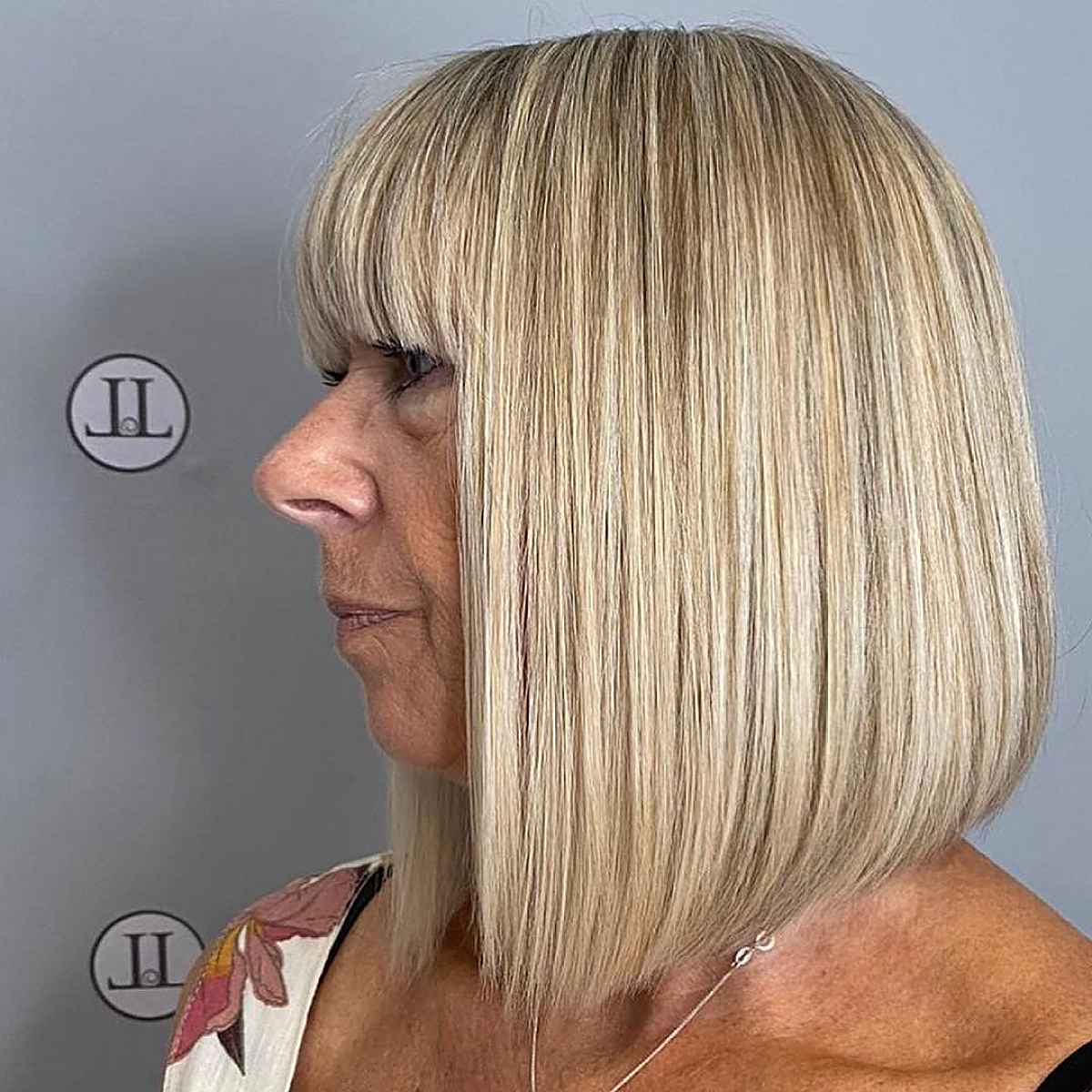 very long lob with highlights for a woman in her 60s