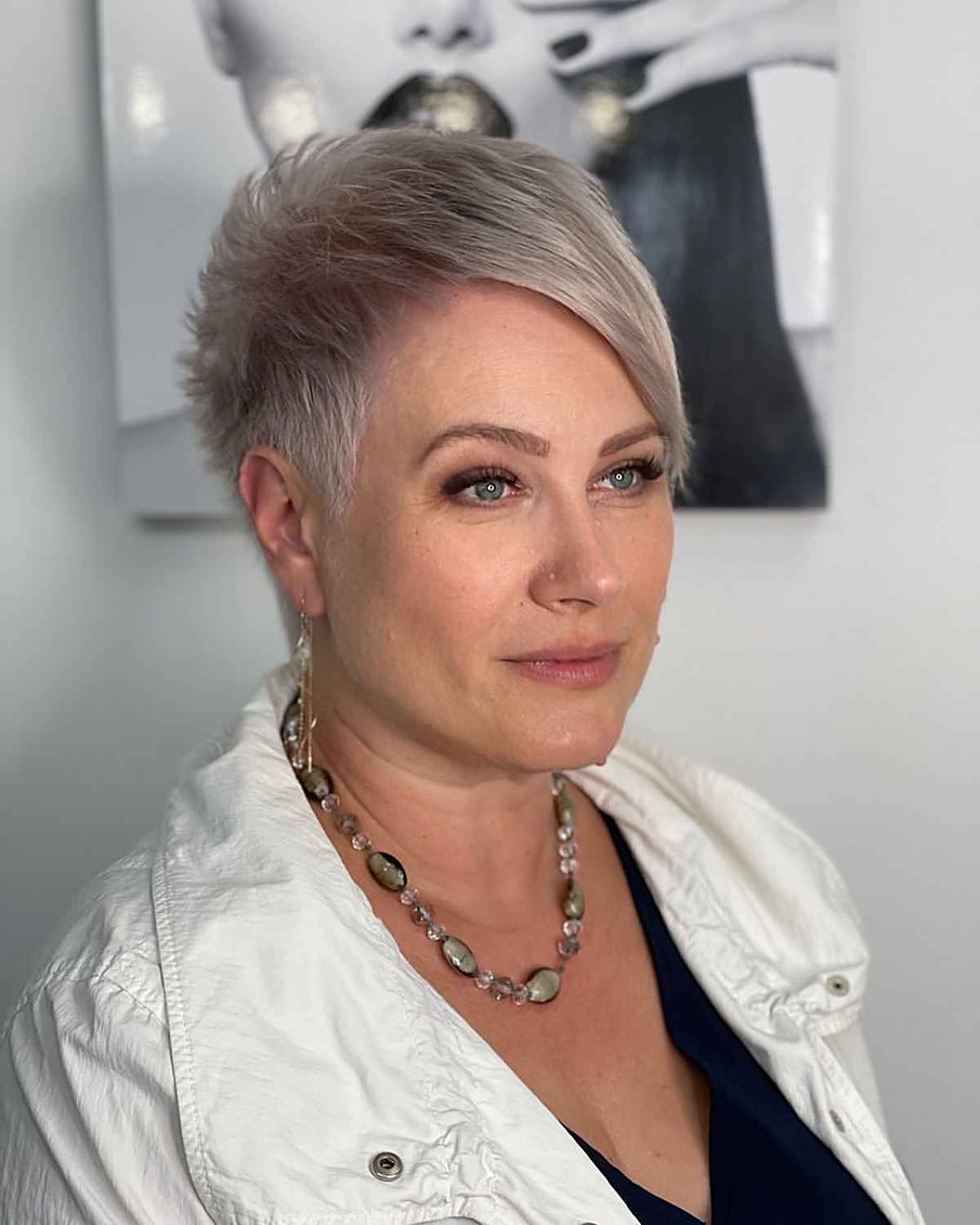 very short pixie hairstyle for older women over 40 with long bangs