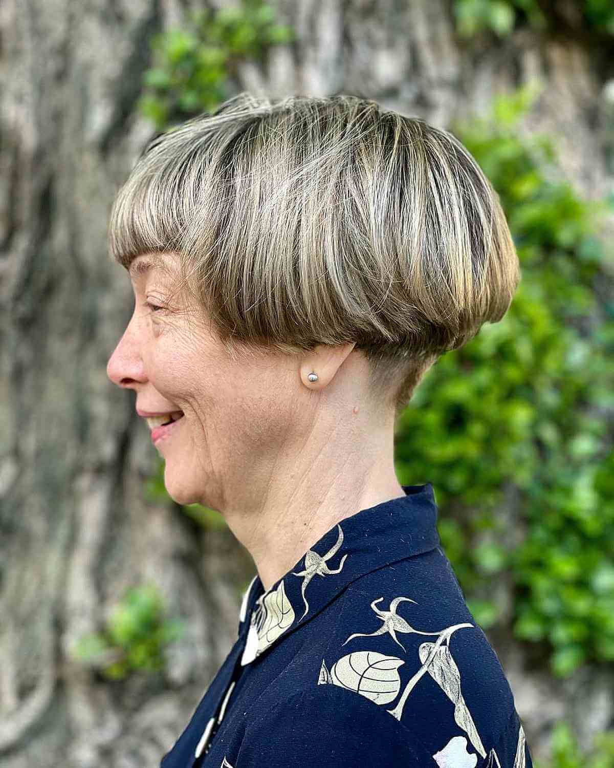 very short undercut wedge bob with blunt bangs for 70 year olds