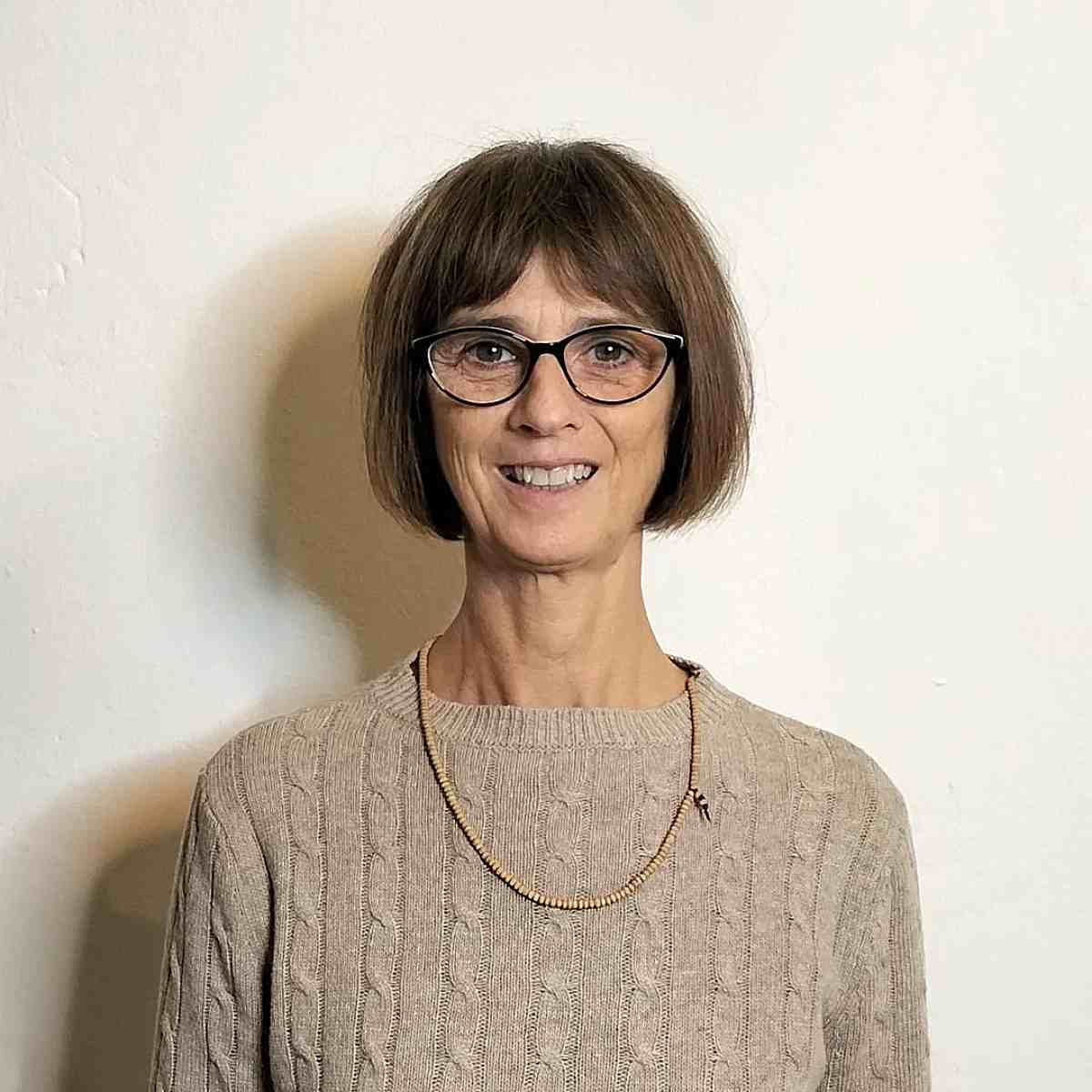 wash and wear style with bardot bangs on bobbed hair for ladies over 60