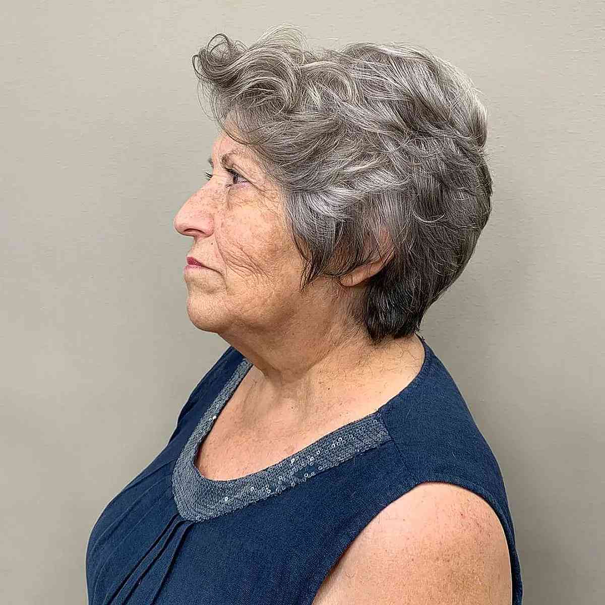 wavy graduated pixie on grey hair for a woman in her sixties