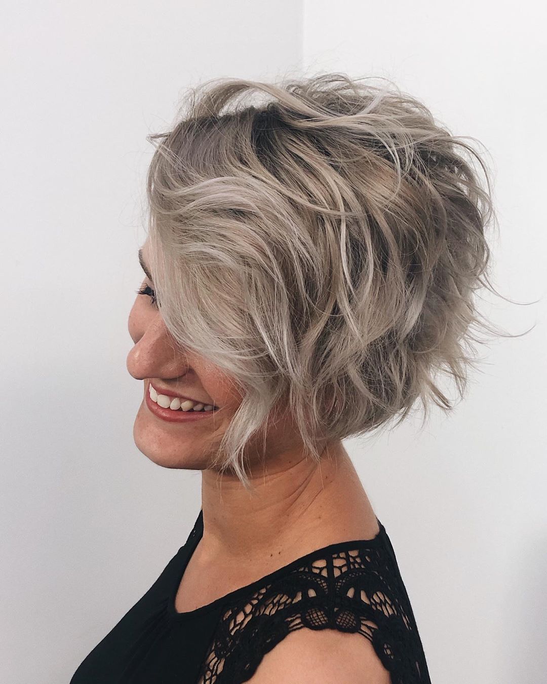 wavy layered bob with side swept bangs