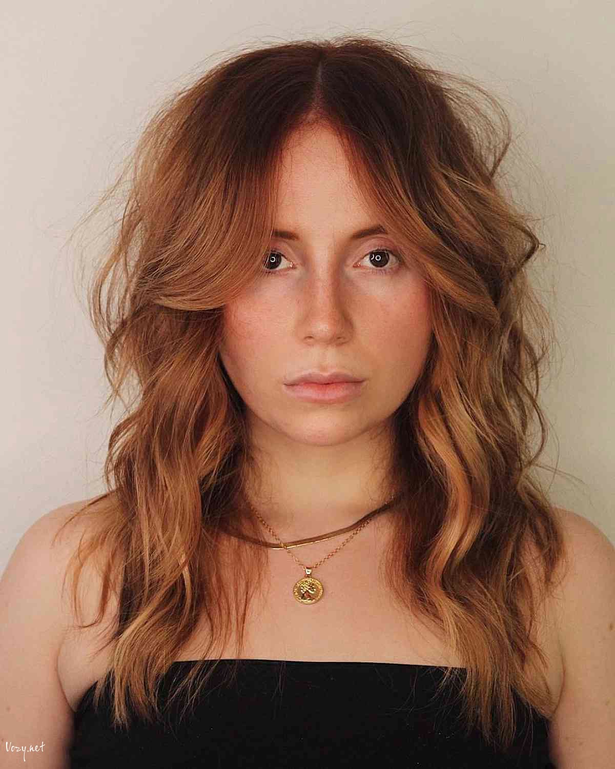 wavy modern shag with a middle part and bangs