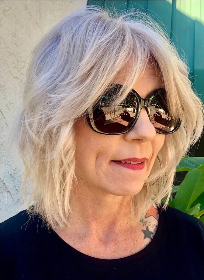 wavy shag haircut for women past their 50s fine hair
