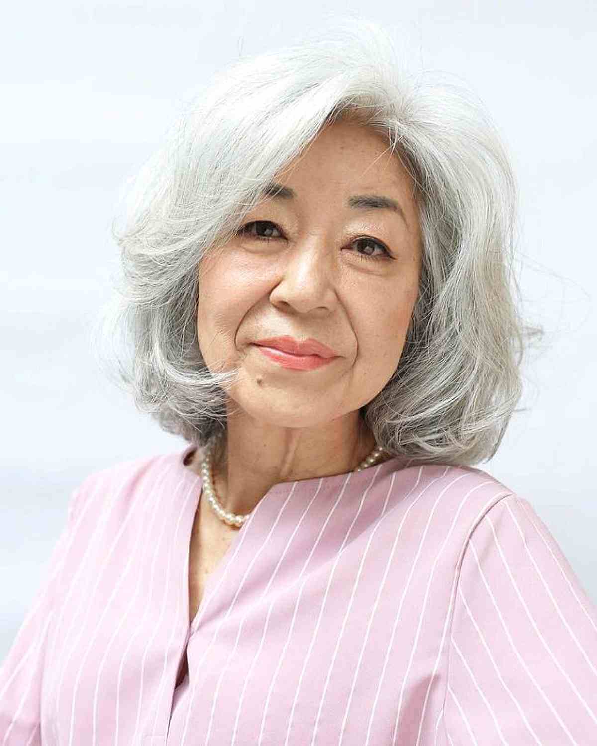 white grey layered long bob for ladies 60 and over