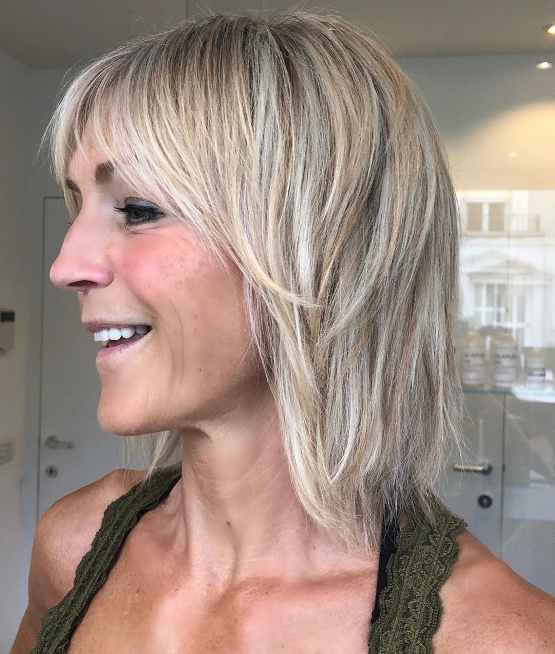 woman over 50 with choppy layered cut shag