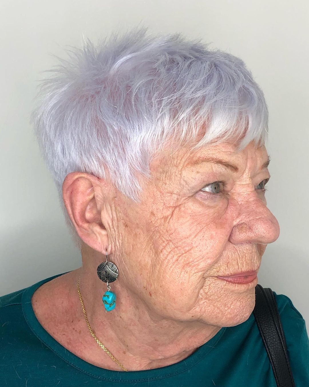 woman over 70 with short choppy gray hair