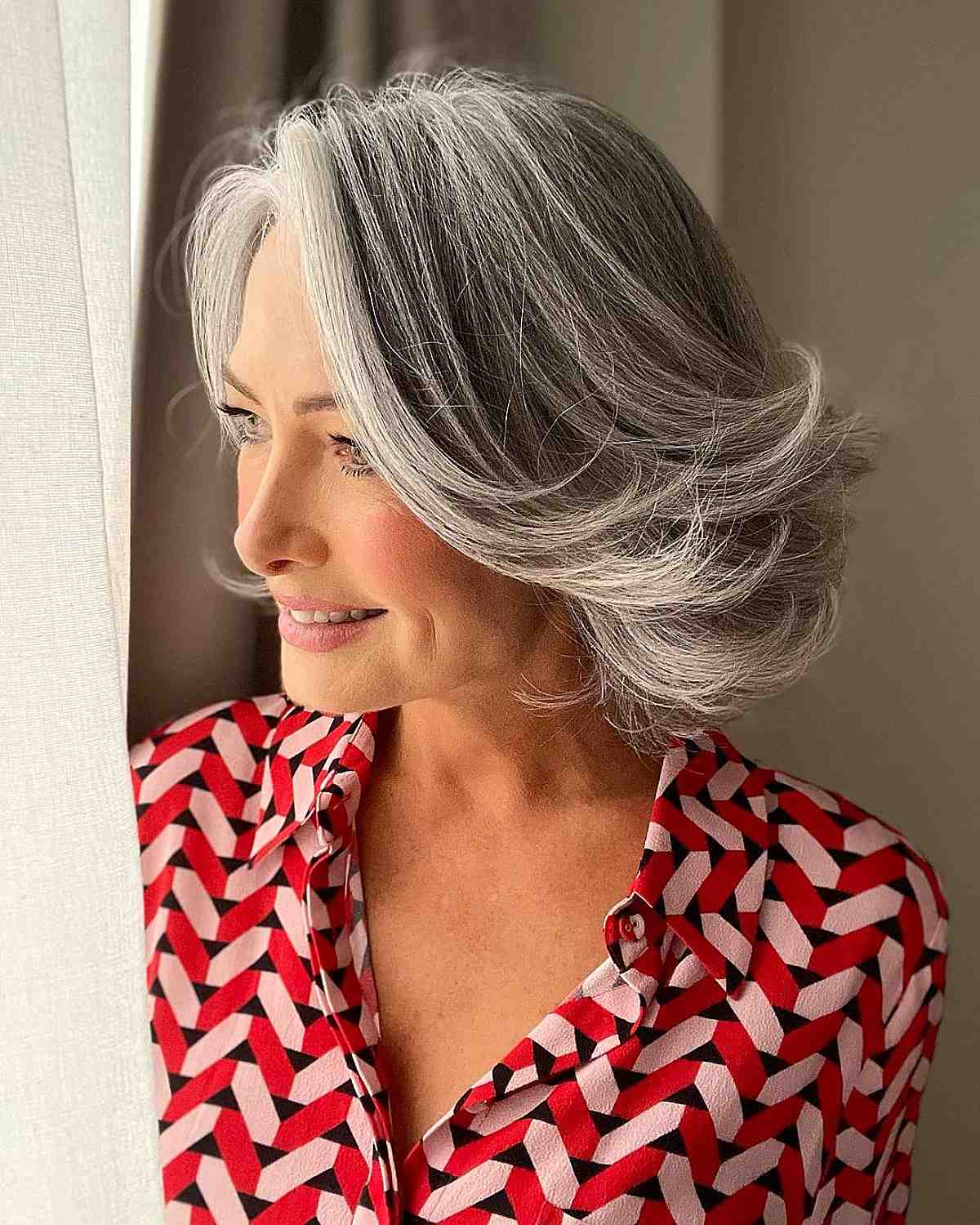 youthful gray bob hairstyle for an older lady over 50