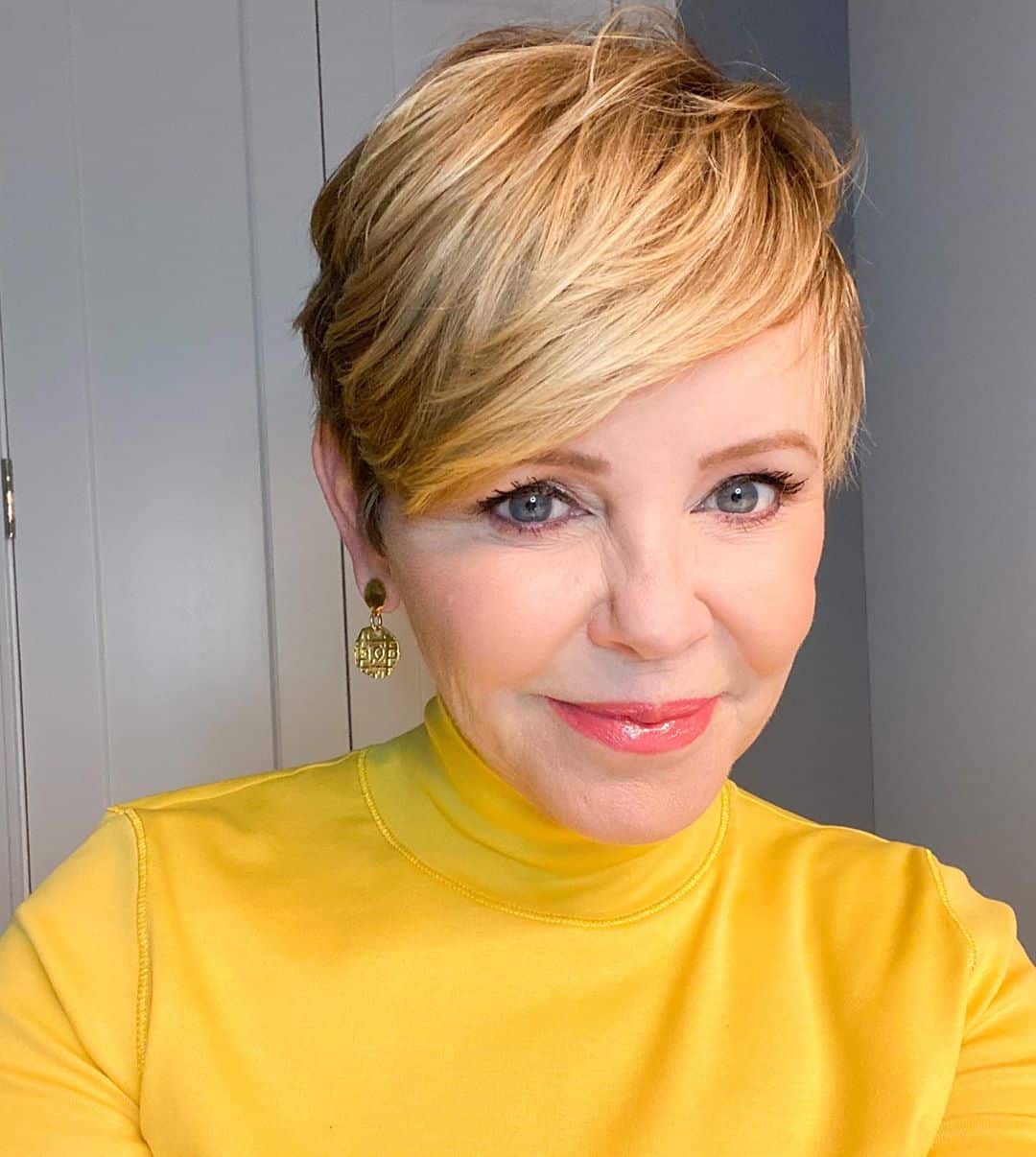 youthful pixie cut with long bangs for older women