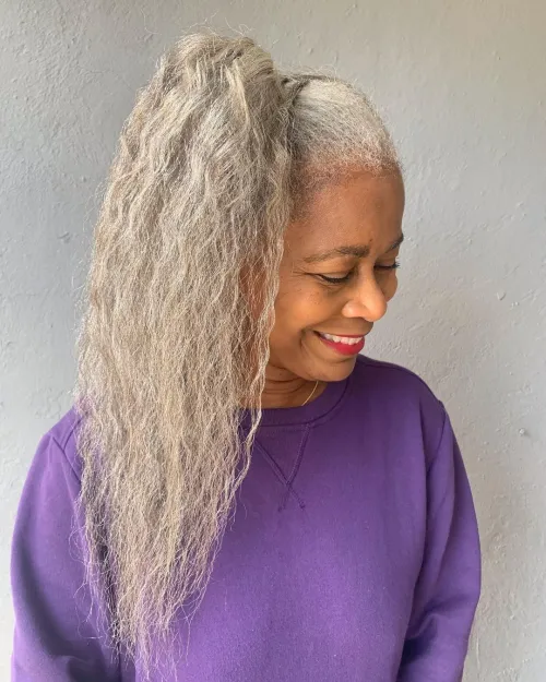 13 white black hair styled into a high side ponytail