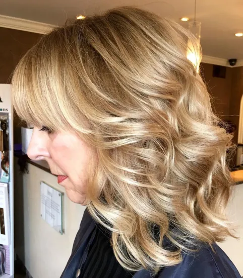 Medium Wavy Hairstyle with Bangs