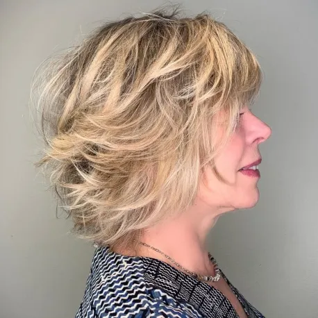 Over 50 Shorter Feathered Blonde Hairstyle