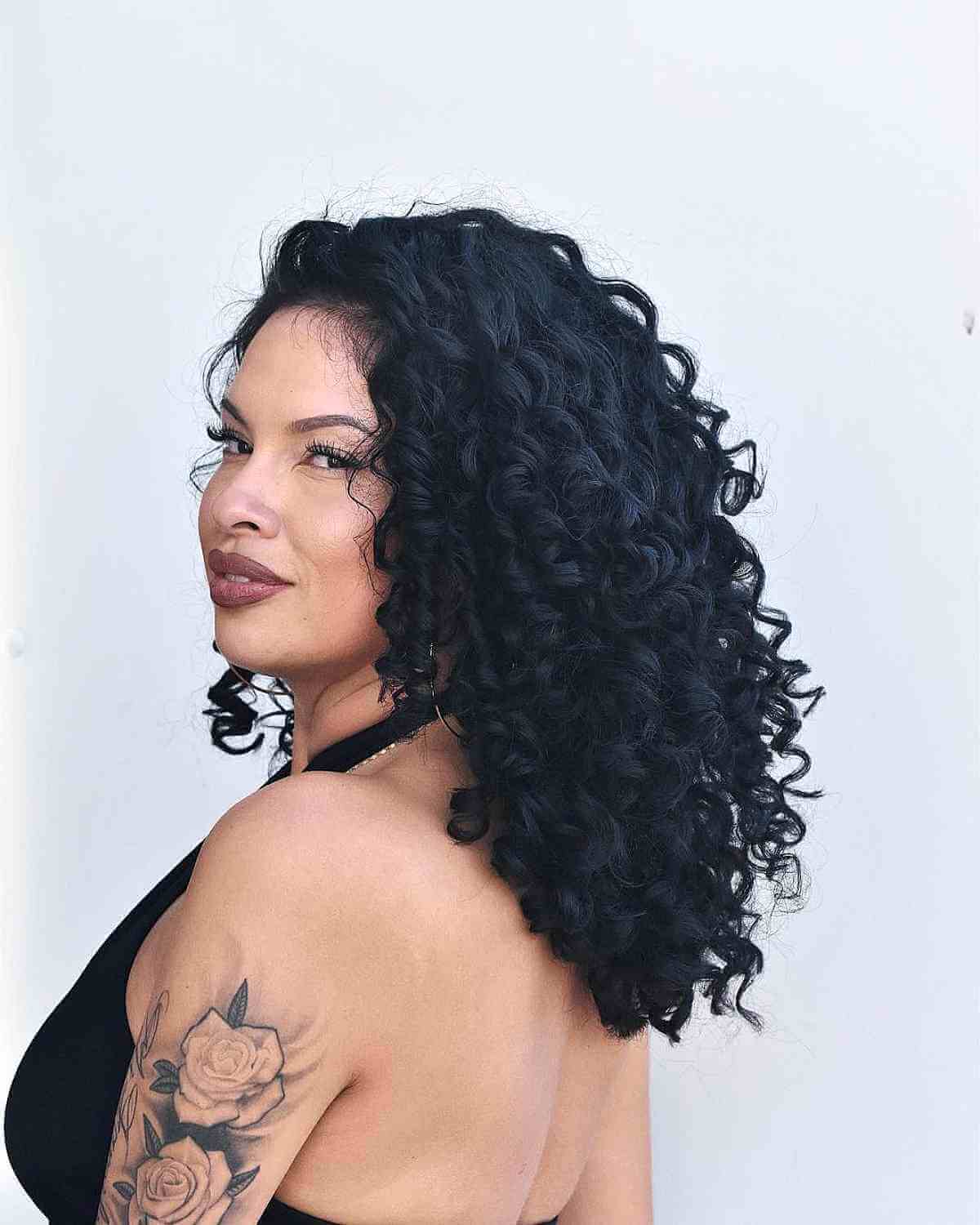 bold medium length jet black curls