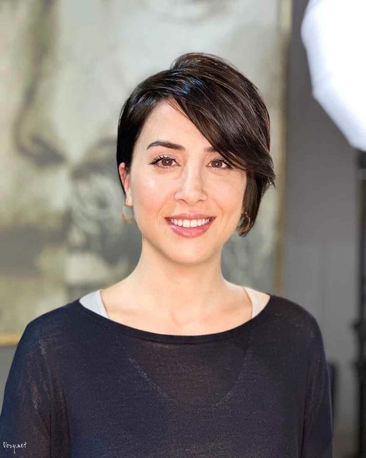 brunette pixie bob with long side bangs