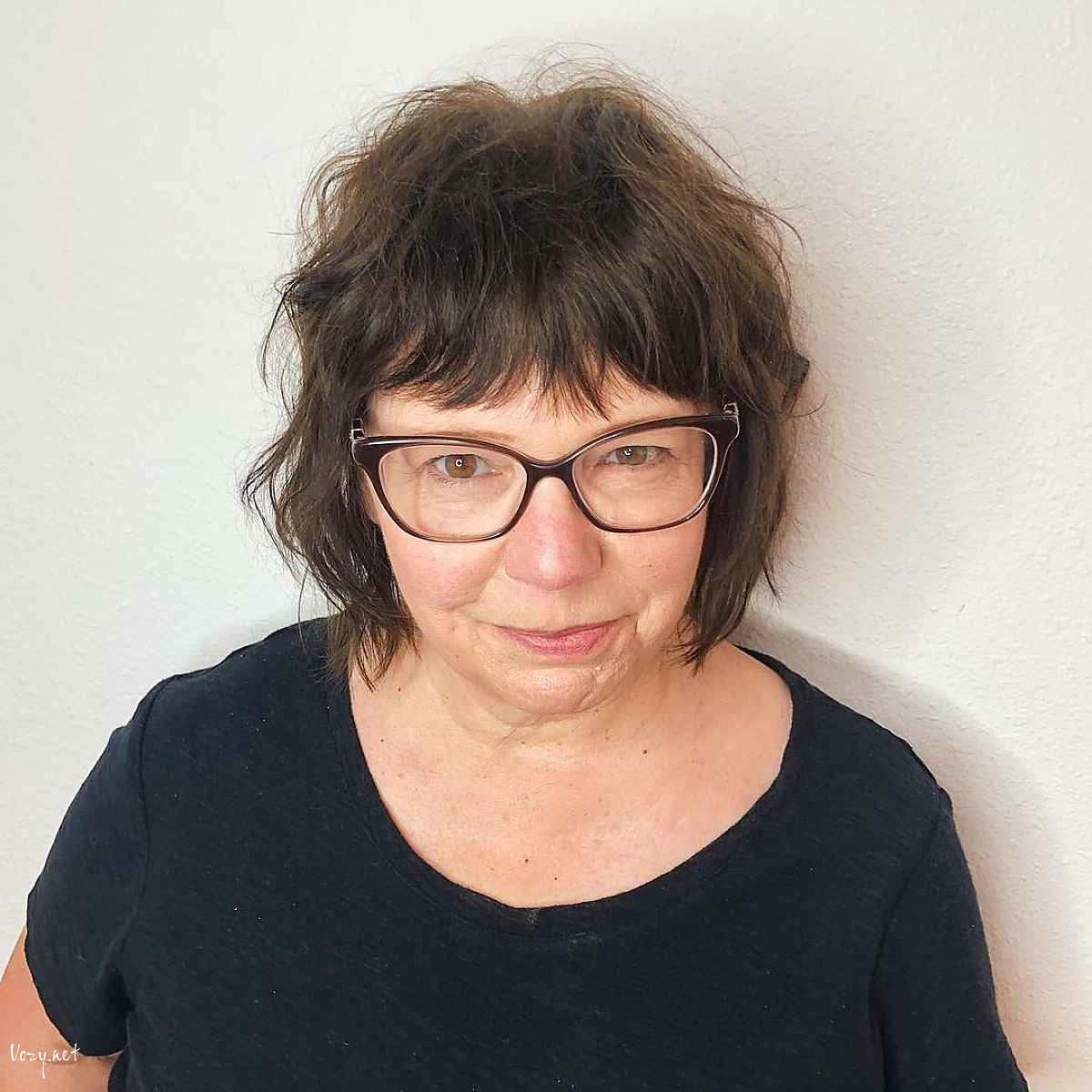 chin length shaggy cut with glasses