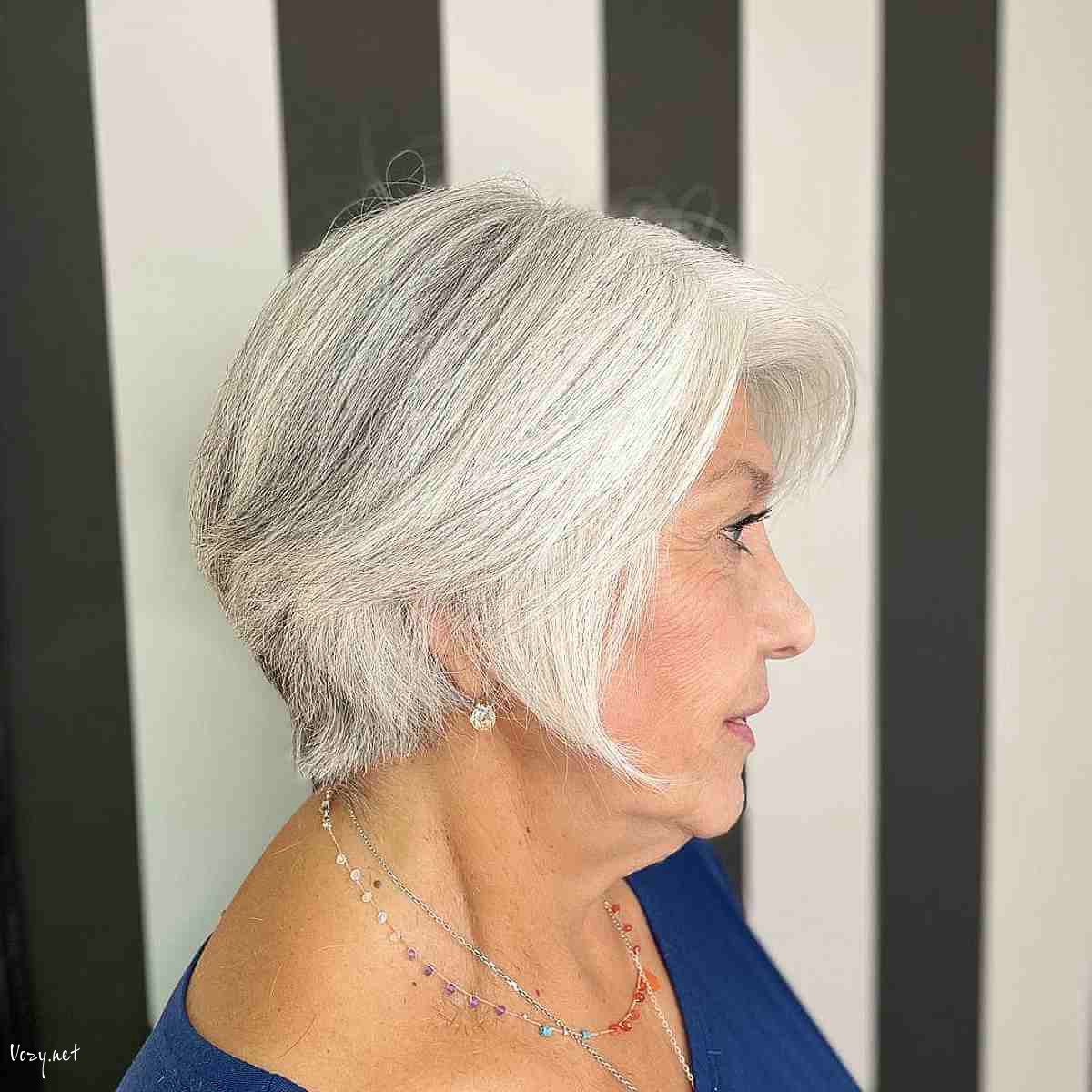 classy pixie bob for women over 50 with white hair and round faces