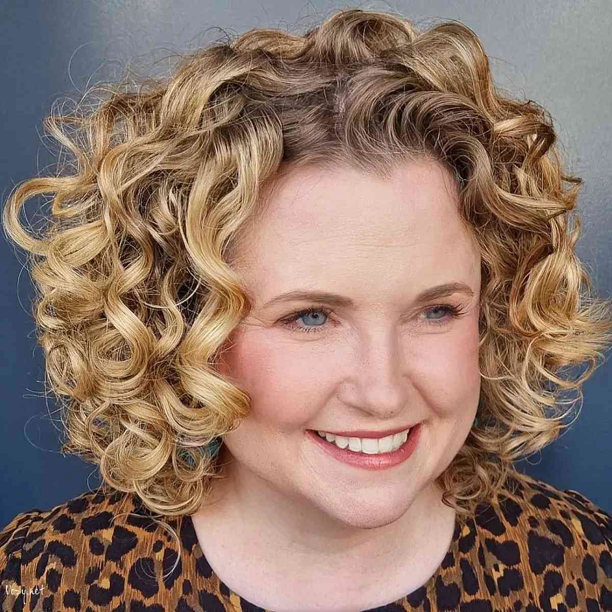 curly bob hairstyle for ladies over fifty with round face shapes