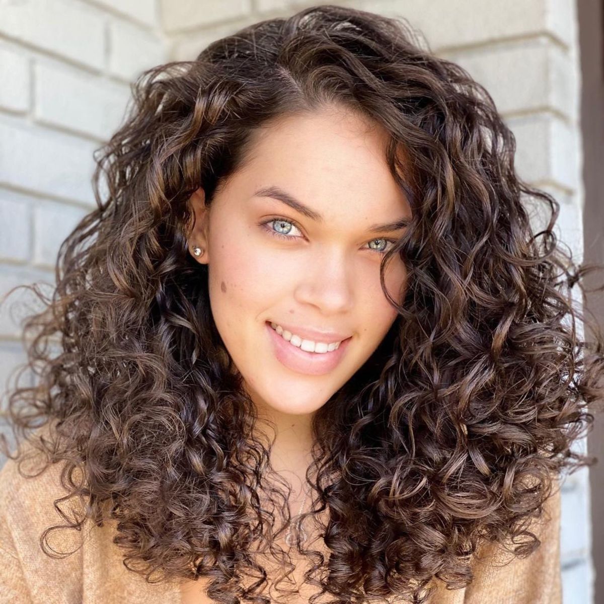 dark brown medium length curly hair style