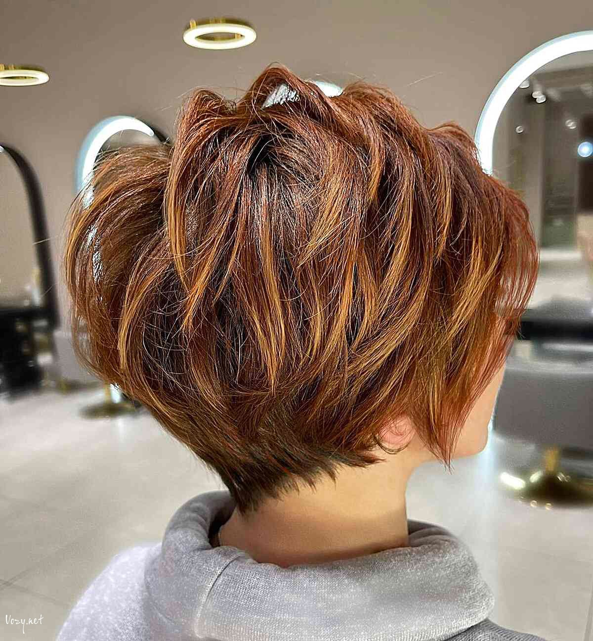 dark copper pixie bob with layers and a tapered nape