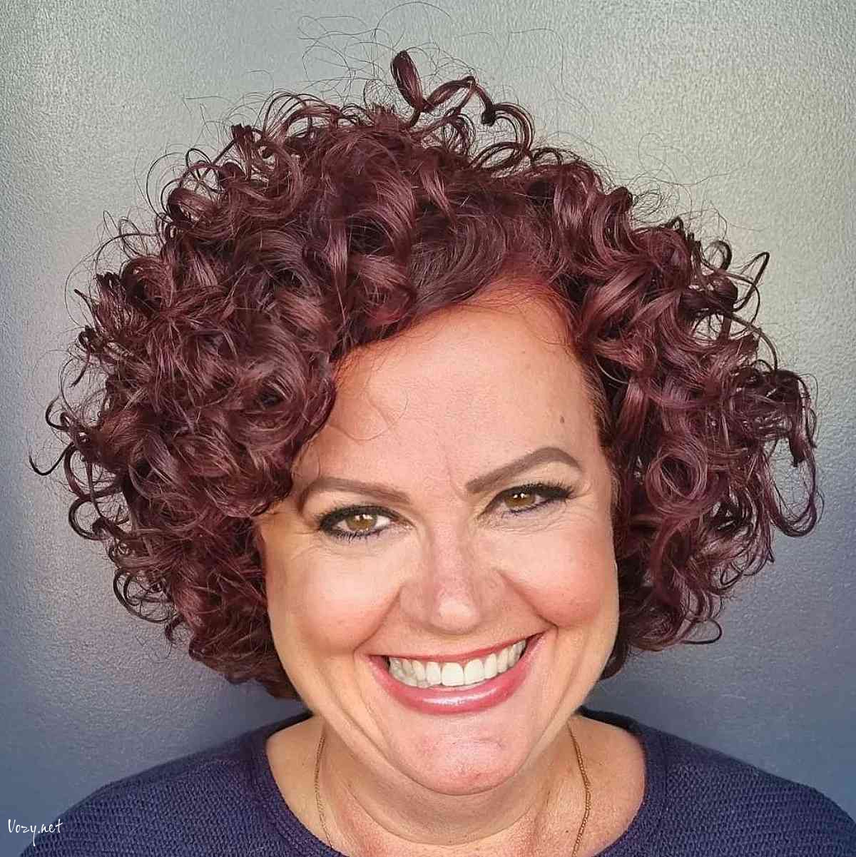 dark magenta bouncy curls for ladies 50 and over with round faces