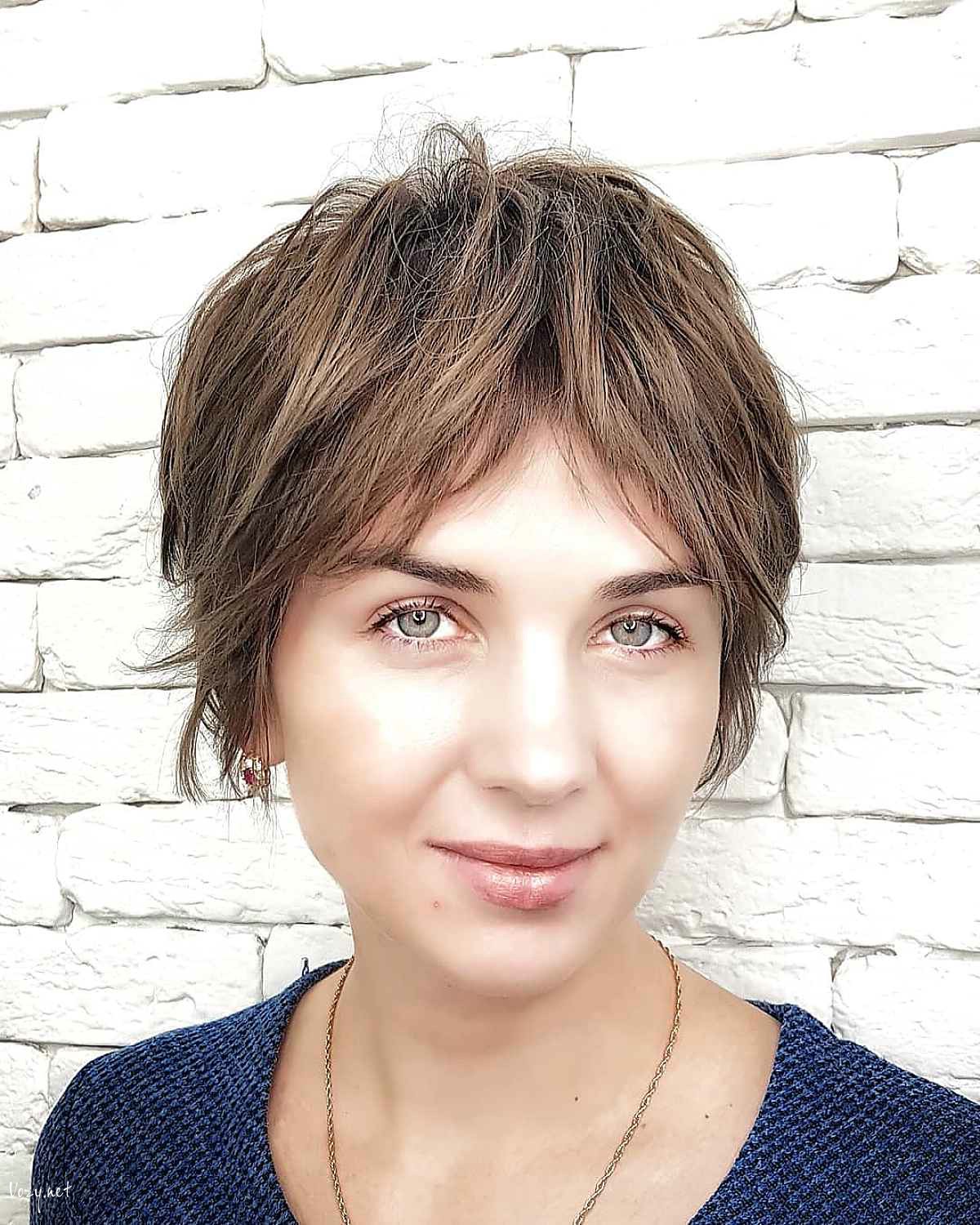 ear length pixie cut with curtain bangs