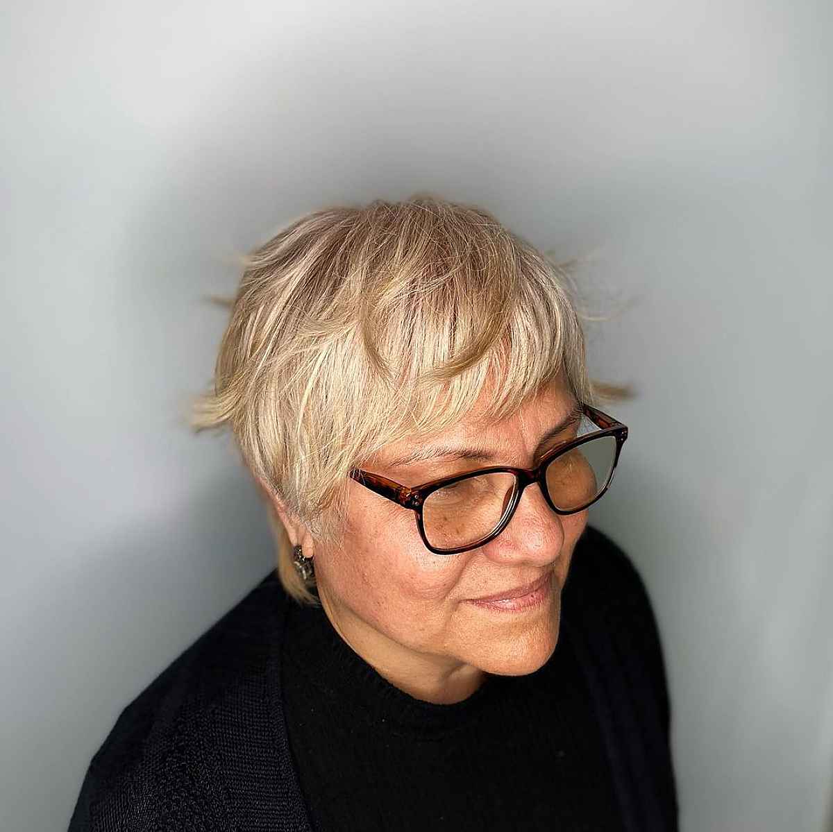 feathered bangs on layered pixie for ladies over 50 with fine hair