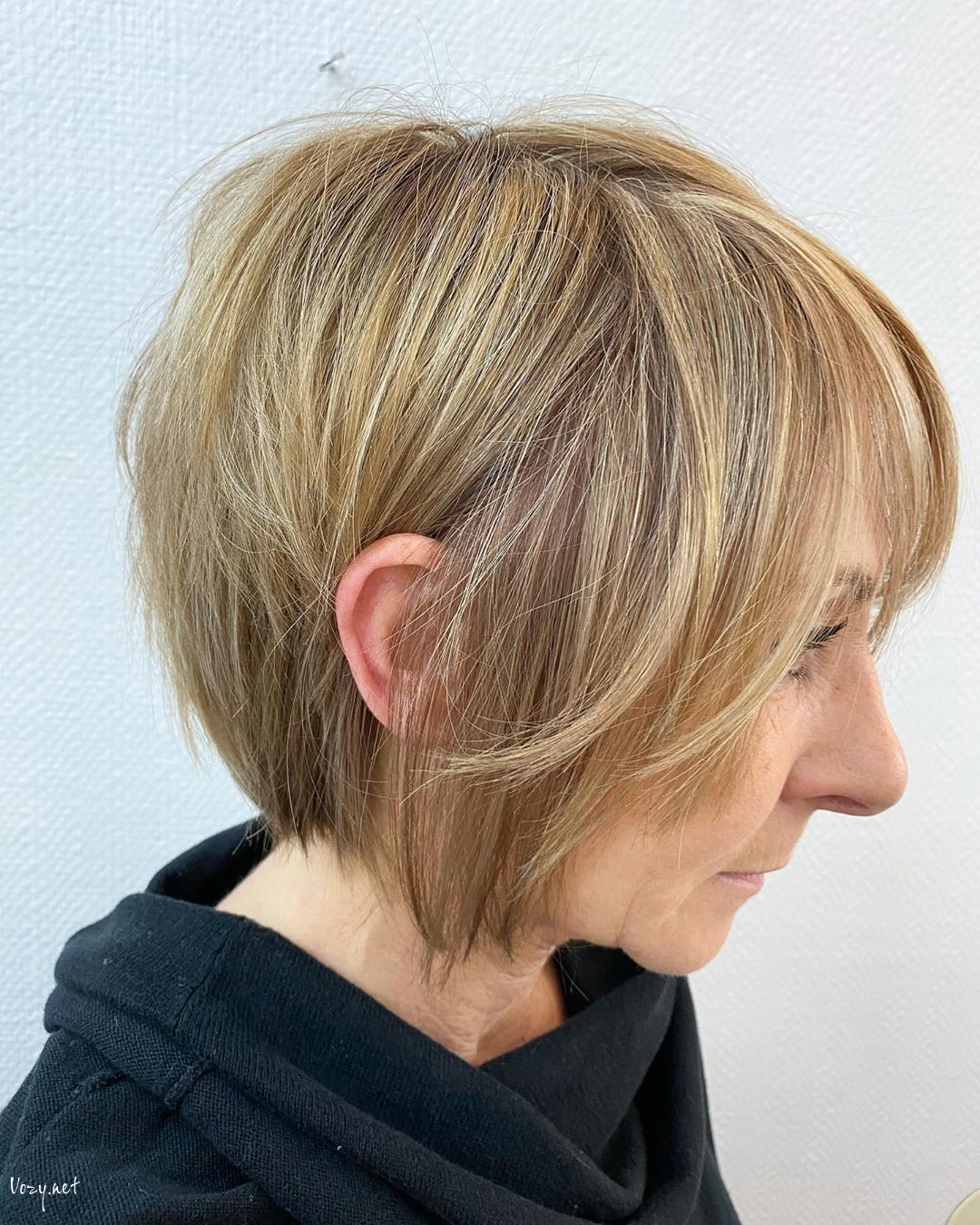 feathered bob for woman in her 50s with round face