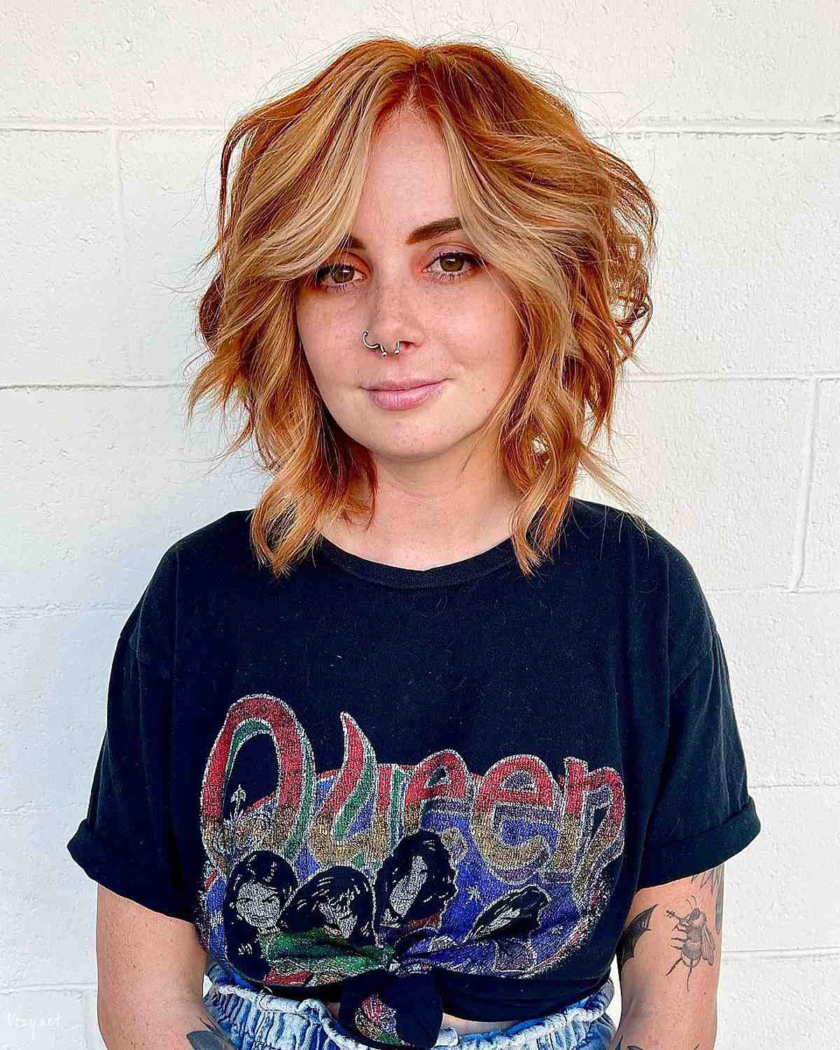 fiery wavy short bob with curtain bangs