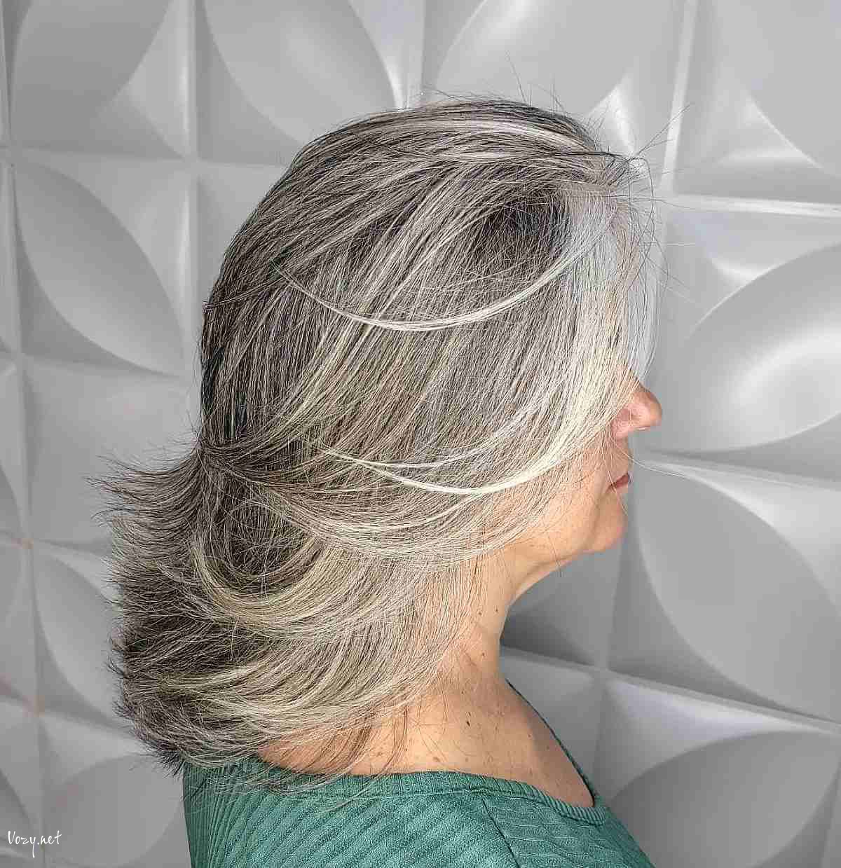 flattering feathered lob with wispy ends for older women over 50 with thick hair