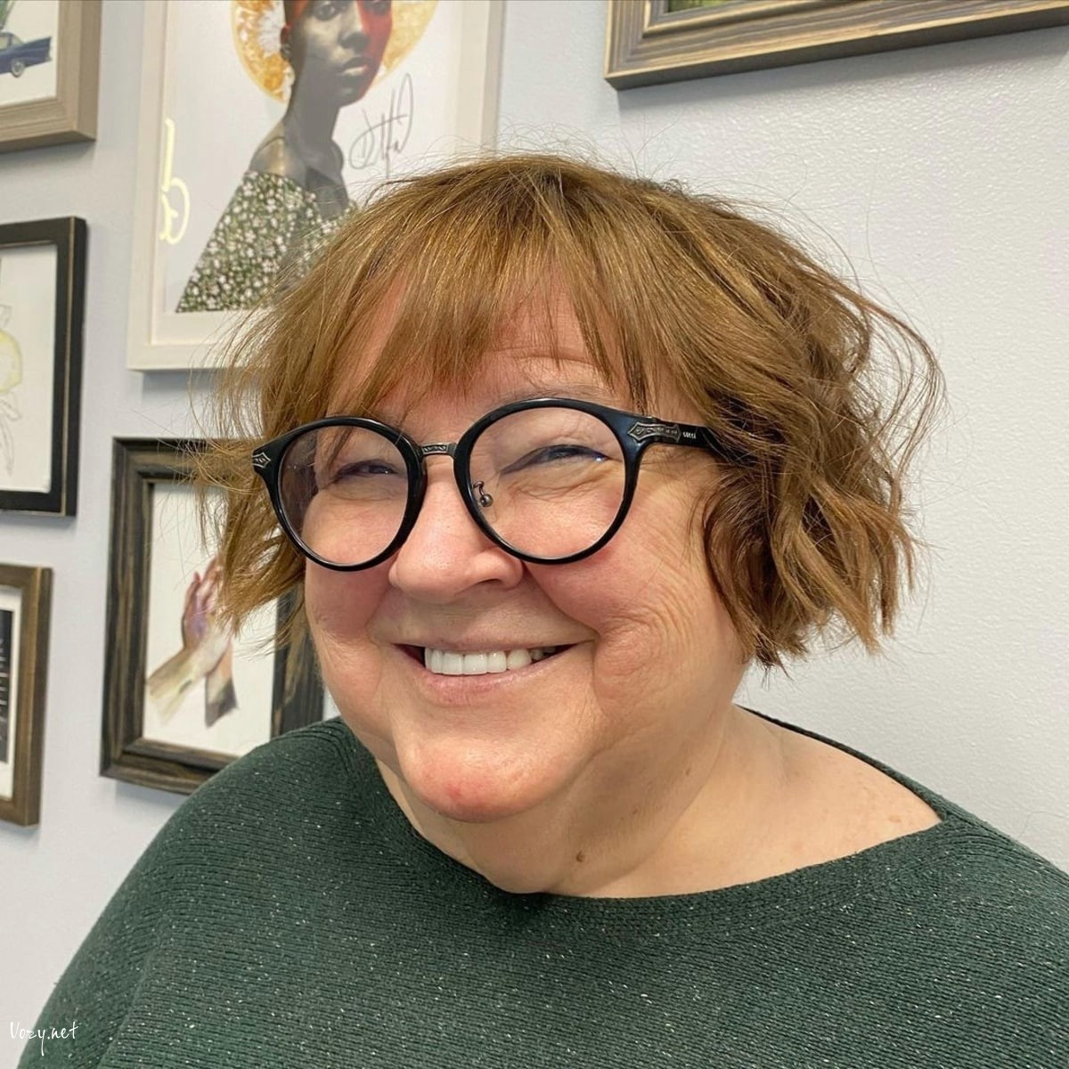 flattering short haircut for women over 50 with a round face