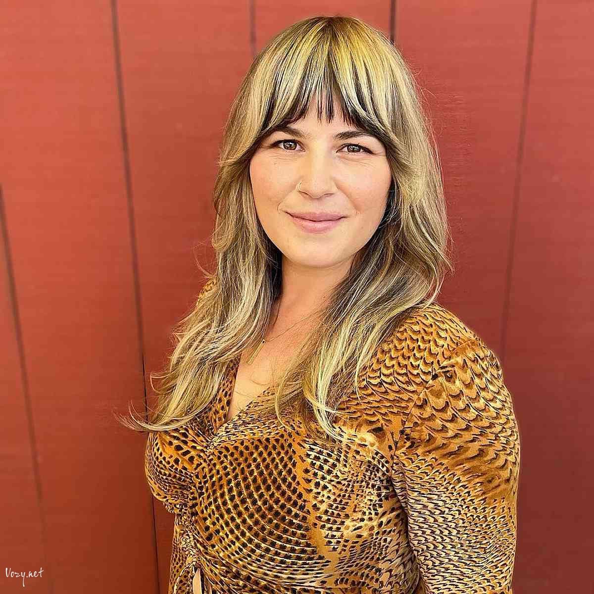 golden wavy shag hairstyle with bangs 1
