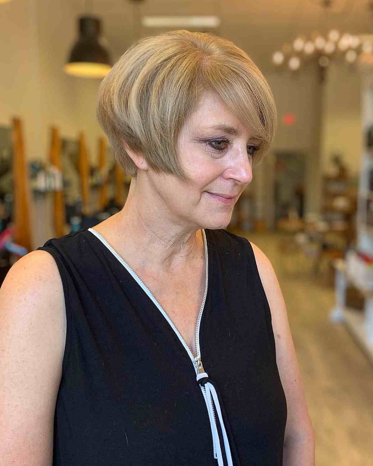graduated bixie with side bangs for thick haired ladies 50 and over