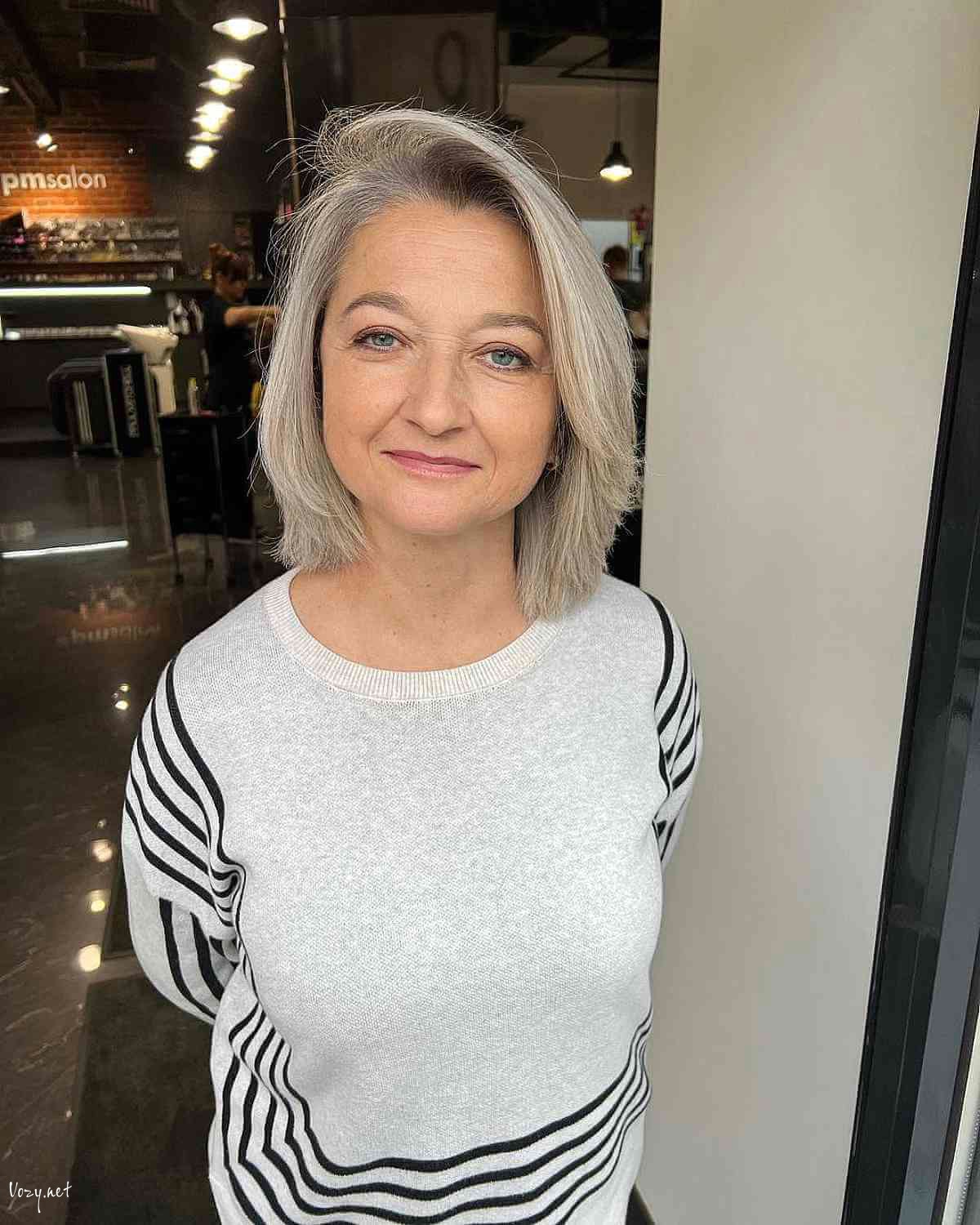 gray layered bob with a side part for 50 year olds