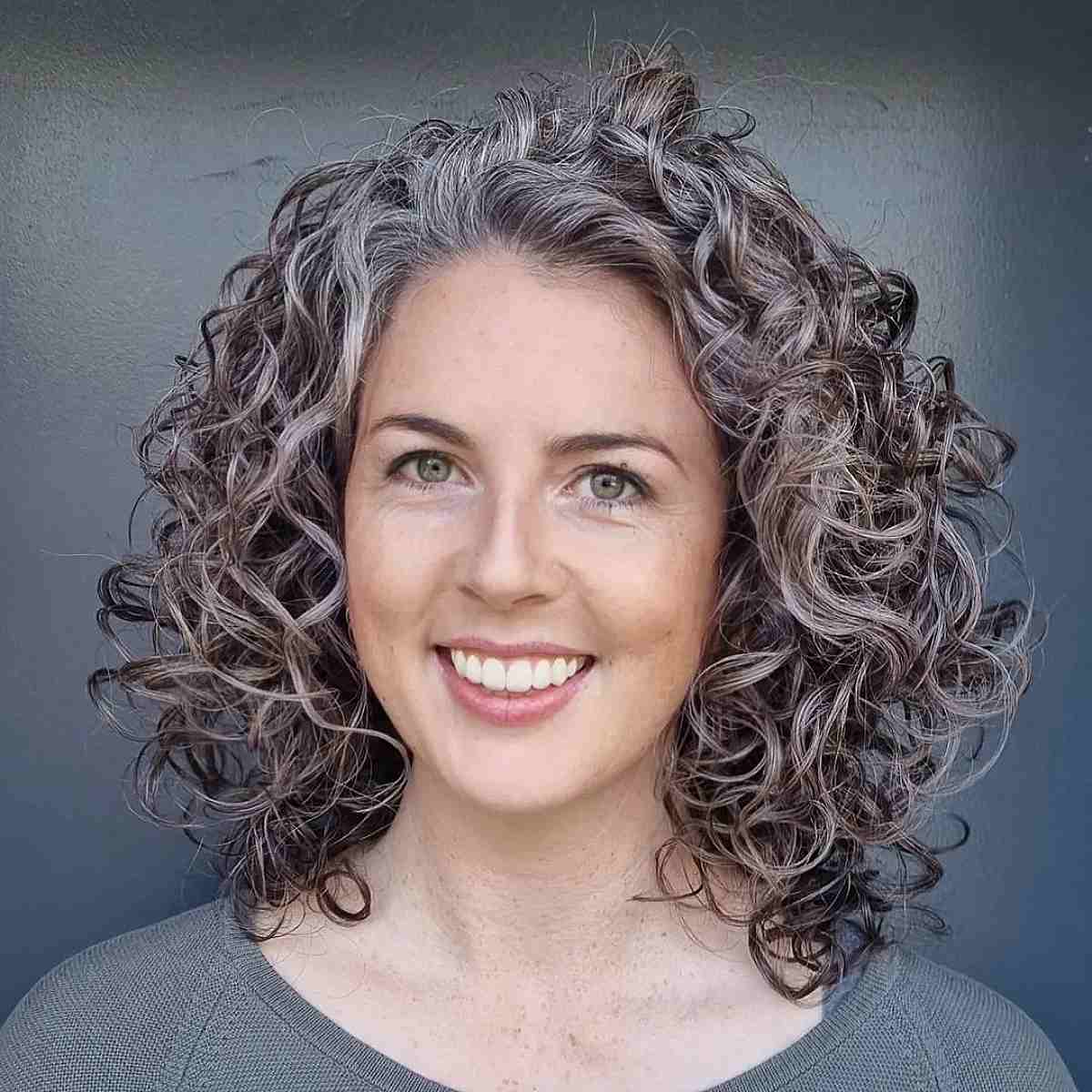 grey curly mid length hair