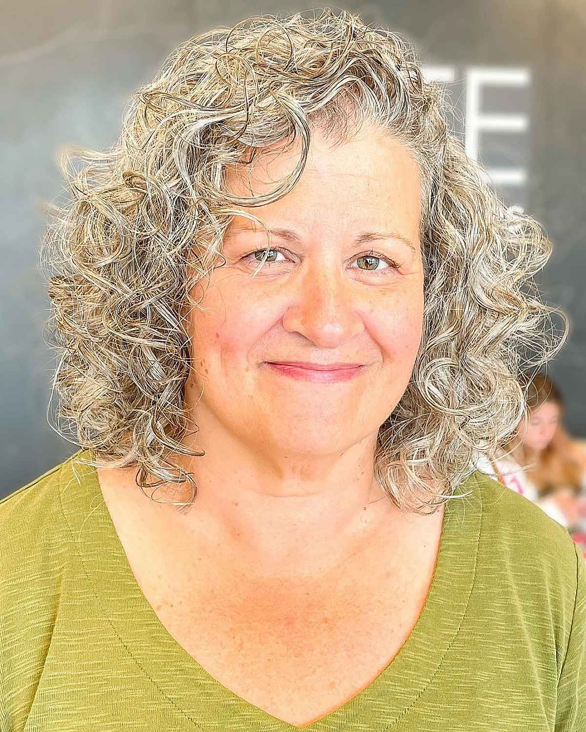 haircut for ladies in their 50s with curly hair