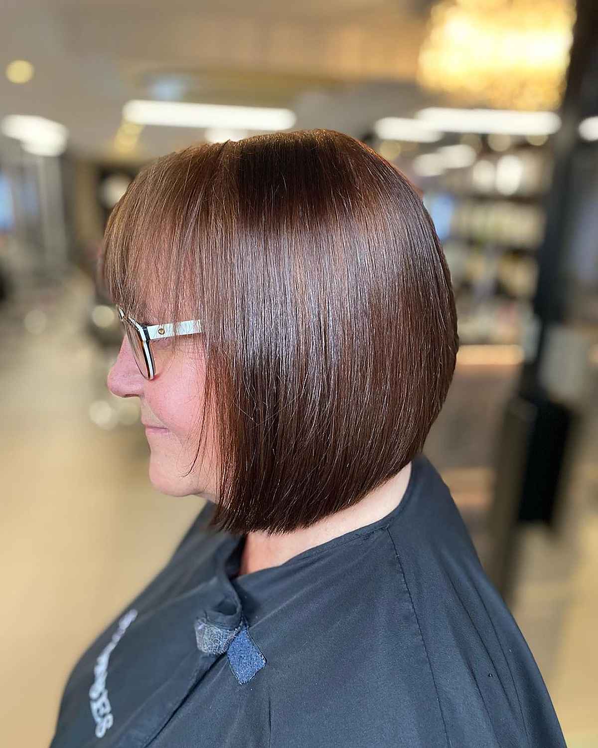 haircut for overweight women over 50 with glasses