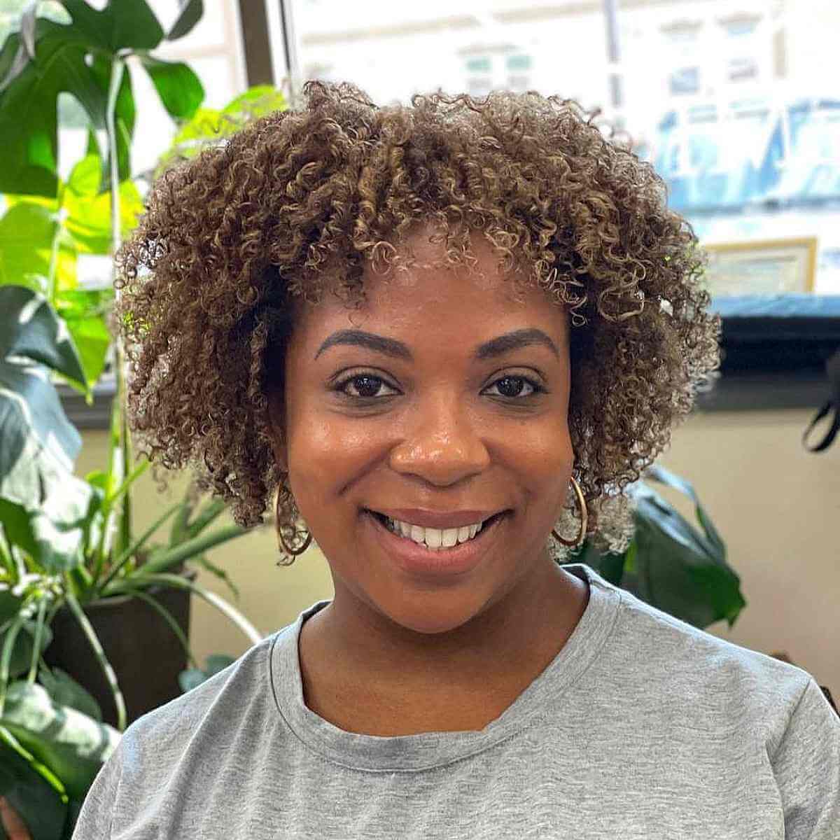 highlighted tight blonde short curls for ladies over forty