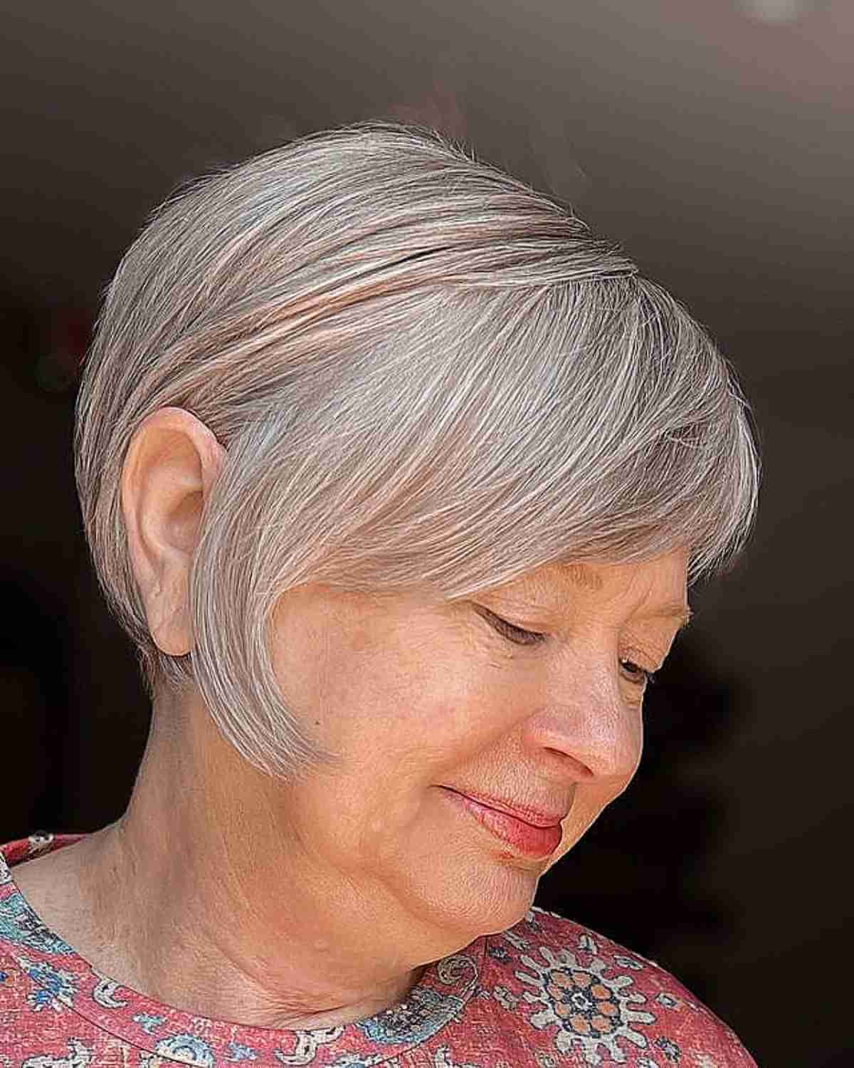 inverted pixie bob with side swept bangs for a lady in her 50s