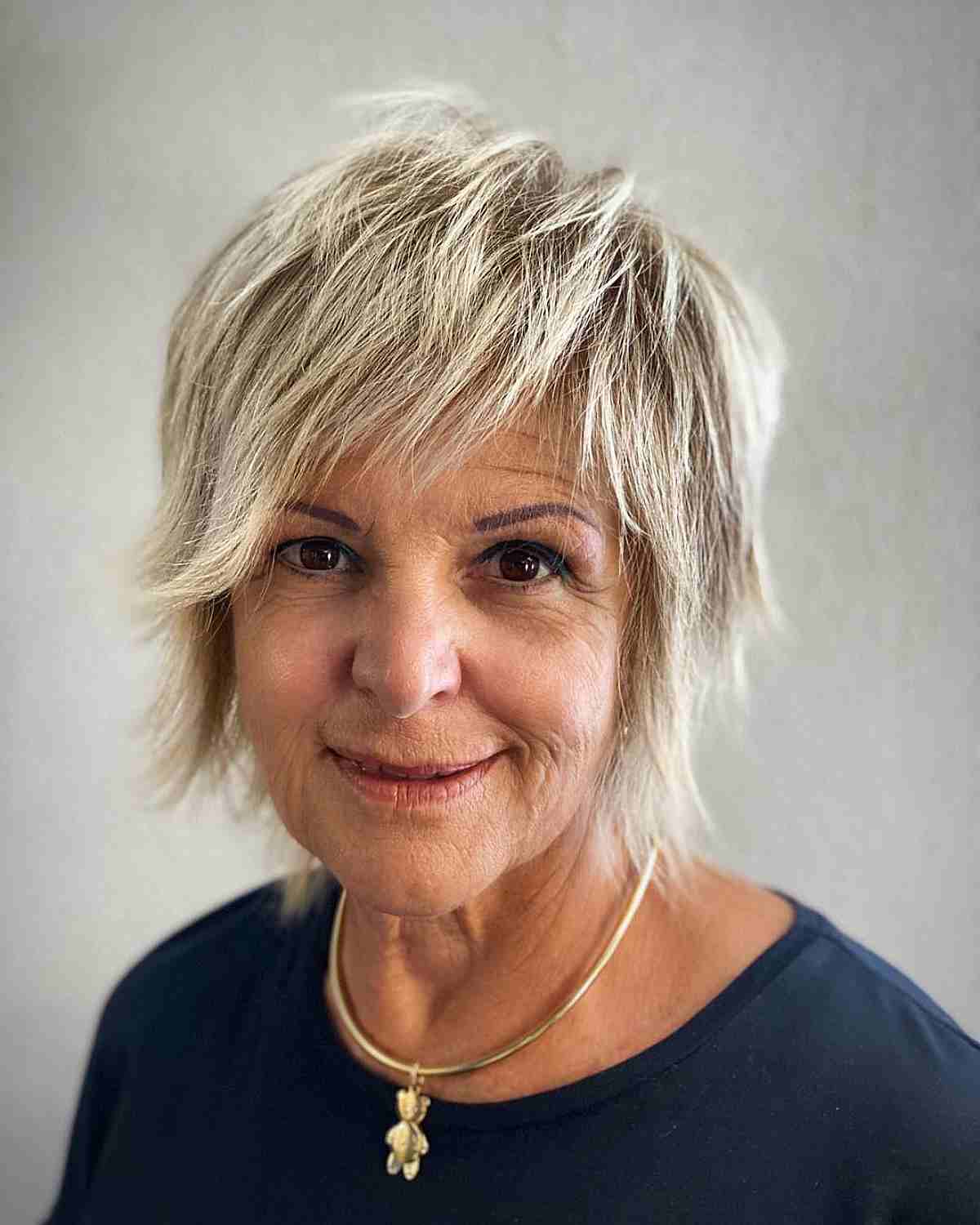 jagged shaggy mullet bob with side swept bangs for ladies over 70