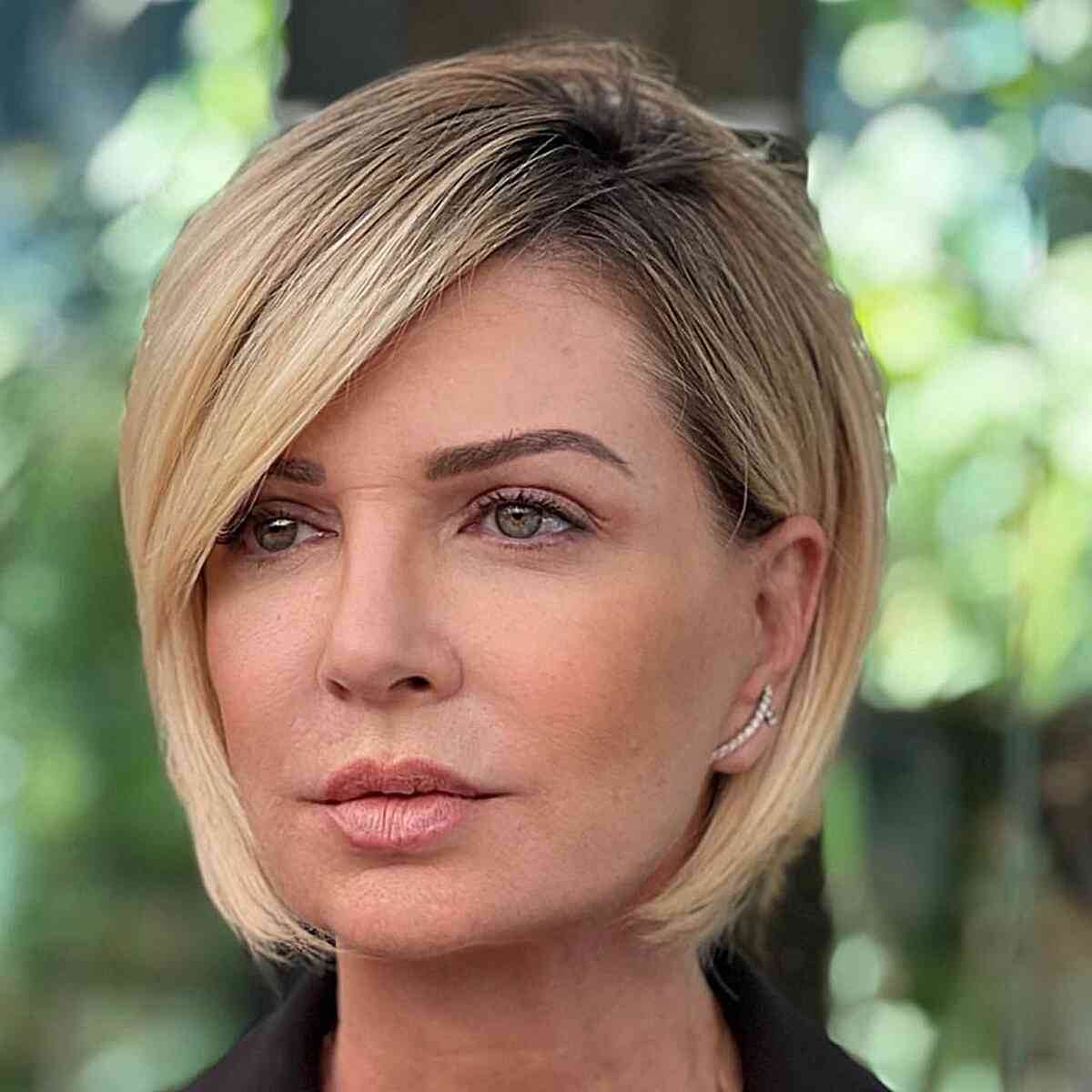 jaw length rooted blonde bob for ladies aged 40