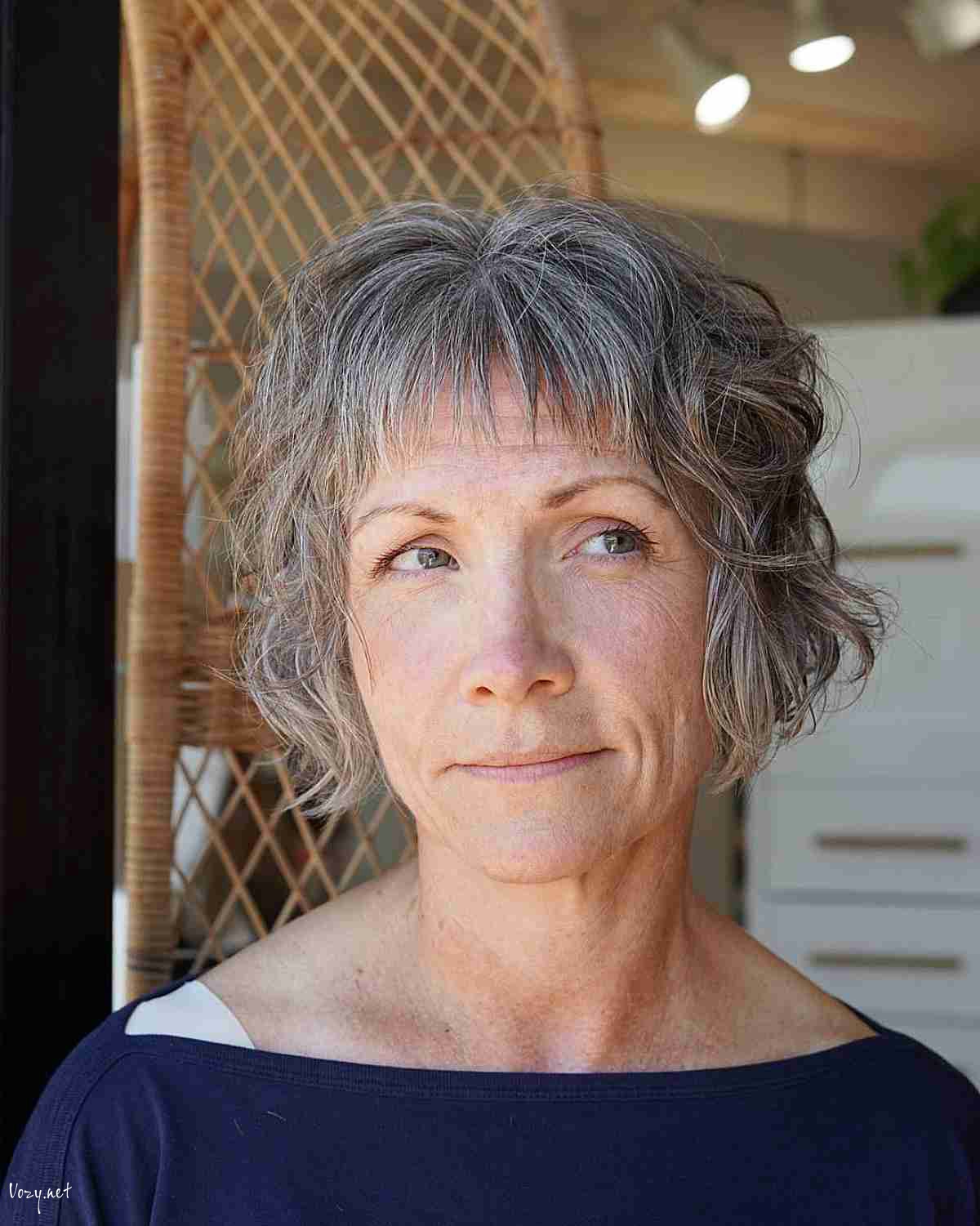 jaw length shaggy french bob with choppy bangs for women over fifty