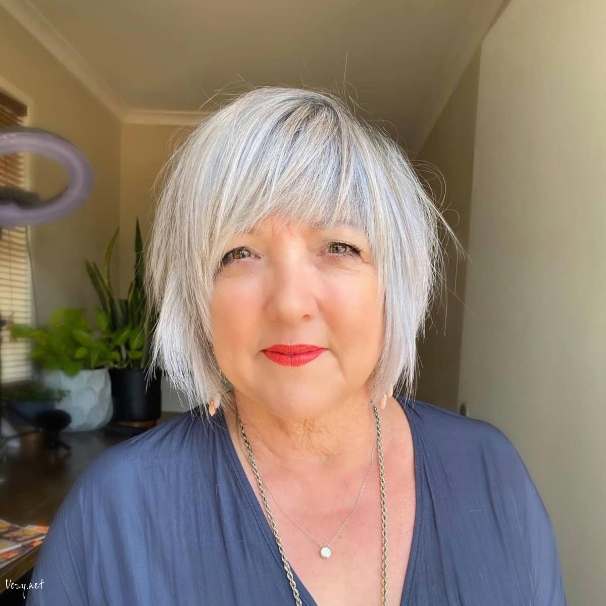 layered bob with bangs for round faces
