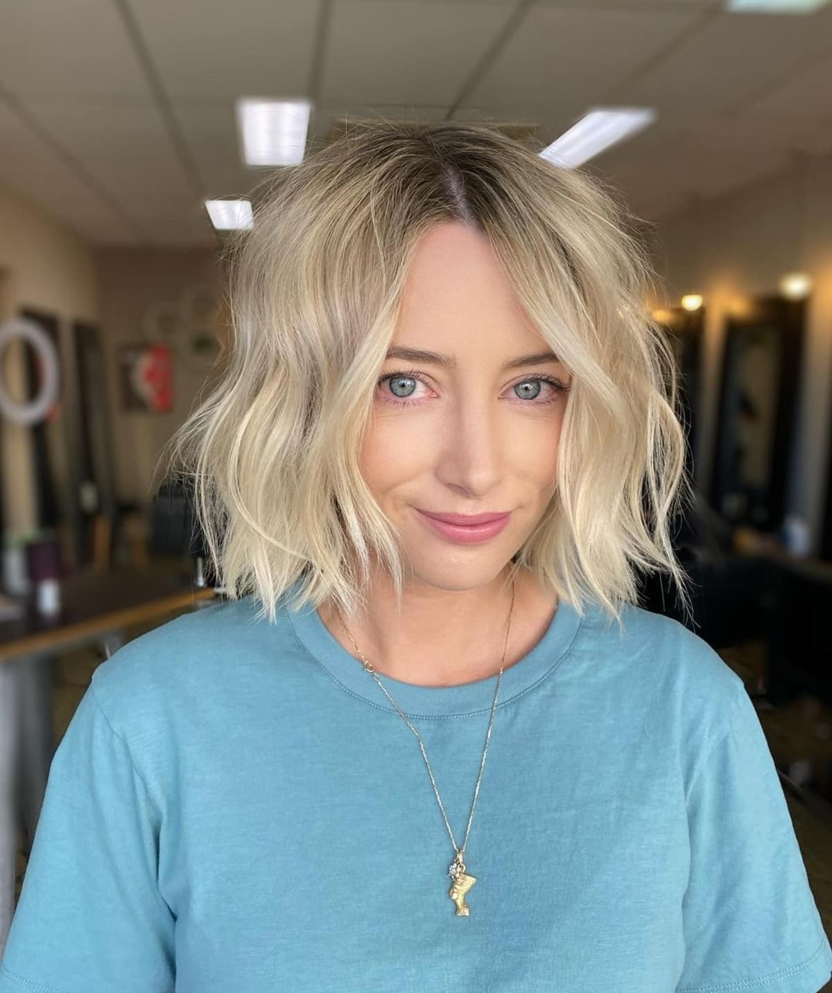 layered bob with loose waves for oval faces