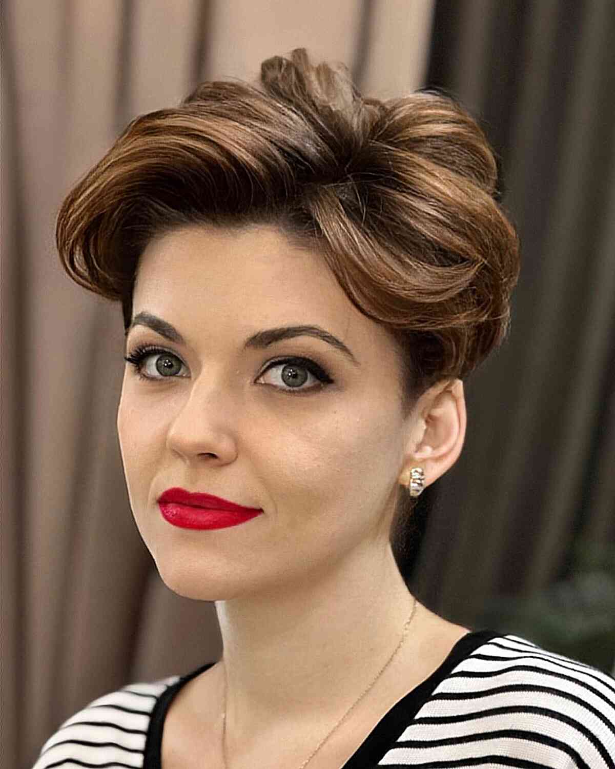 layered pixie bob haircut for wavy locks and oval faces