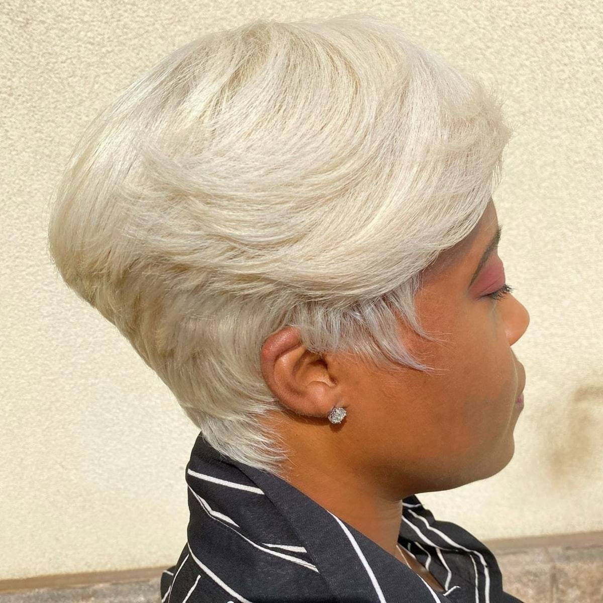 layered pixie with a blonde hair color for black women