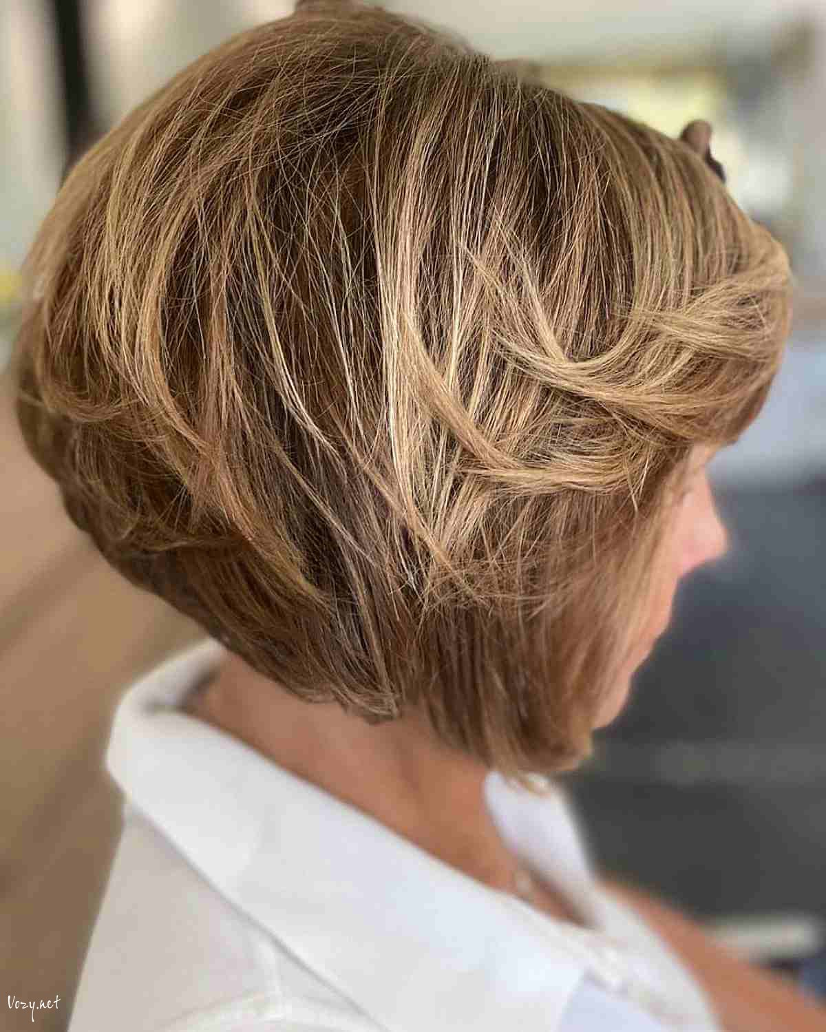 light brown feathered bob layers for women over fifty