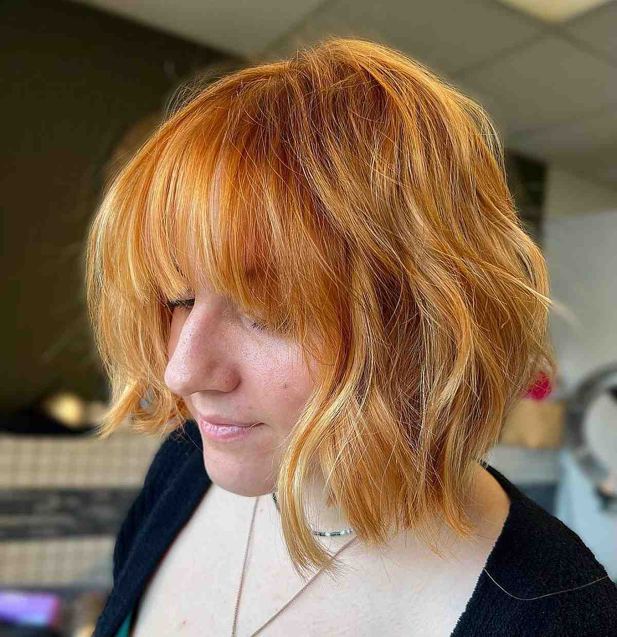 light copper on a textured choppy bob with bangs