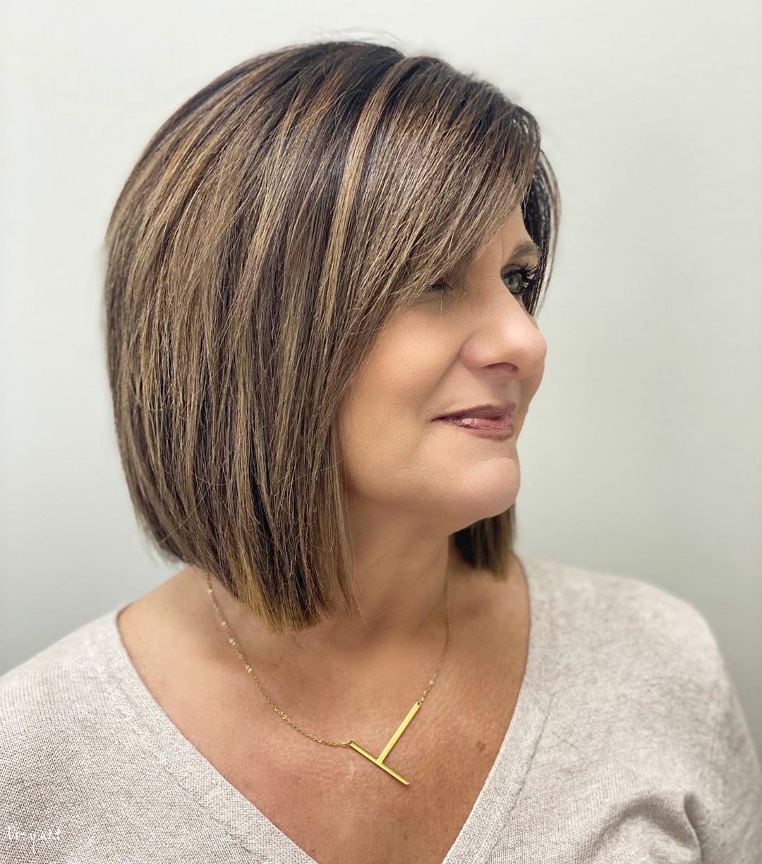 lob with side swept bangs for 50 year old woman with thick hair