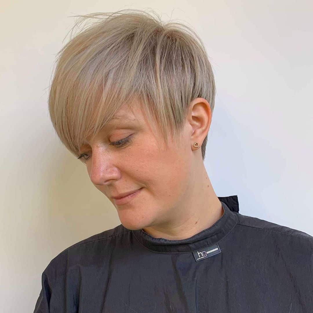 long crop hairstyle for woman over 50 years old with round face